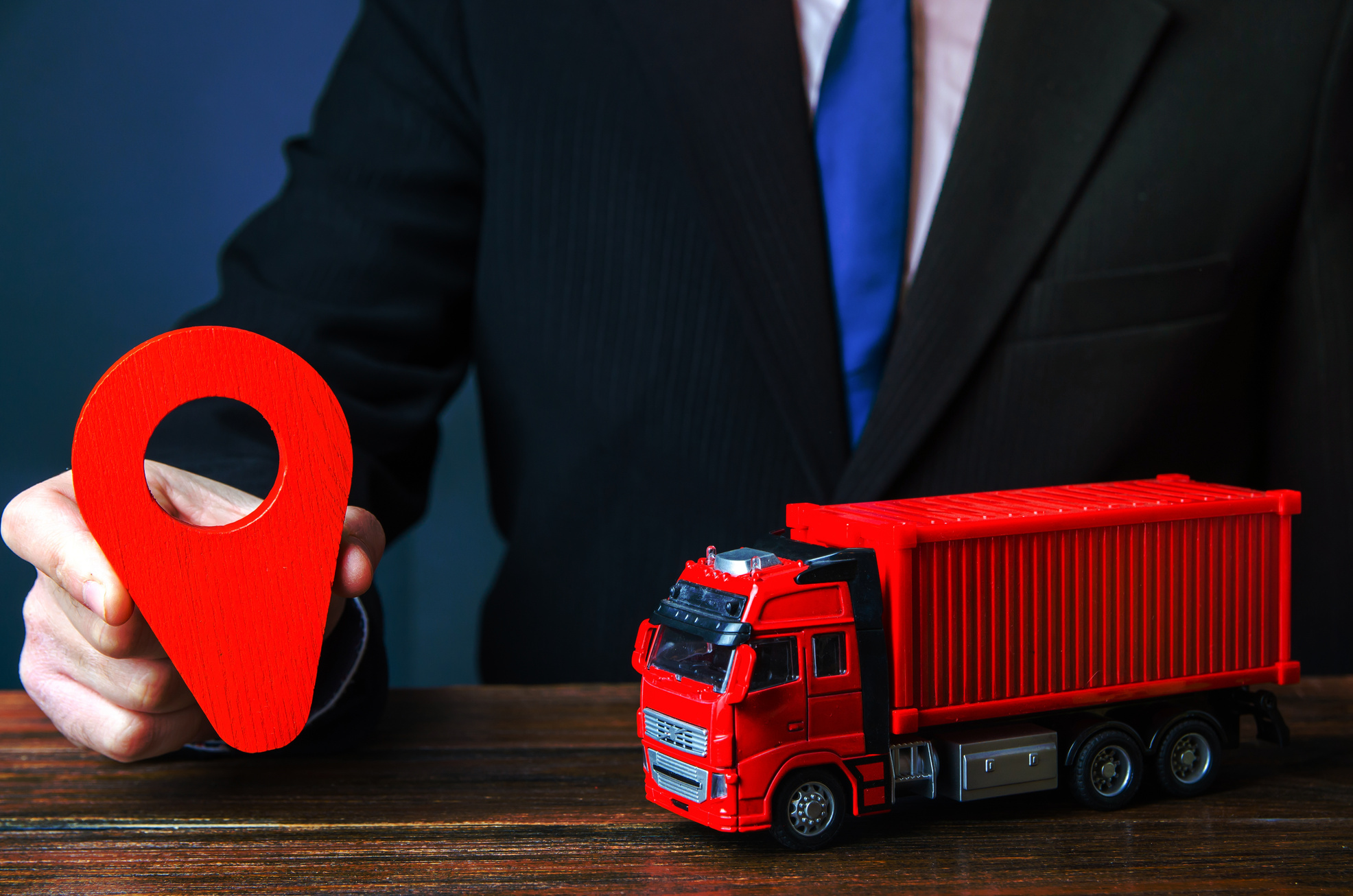 Truck and businessman with red location pin. Transport service infrastructure, business service. Logistics. Transportation company. Package tracking. Express delivery, shipping